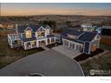 Stunning aerial view of the property showcasing the home, garage, and surrounding landscape at 6685 Baseline Rd, Boulder, CO 80303
