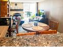 Charming dining area adjacent to the kitchen, filled with natural light and warmth at 805 29Th St # 204, Boulder, CO 80303