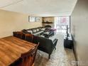 Inviting living room featuring a leather sectional sofa, modern furniture, and a sliding glass door at 805 29Th St # 204, Boulder, CO 80303