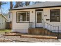 Charming home with updated landscaping, a cozy porch, and clearly visible house number at 809 Sunset St, Longmont, CO 80501