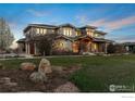Charming residence at 8852 Portico Lane boasts meticulous landscaping, stone accents, and a welcoming facade at 8852 Portico Ln, Longmont, CO 80503