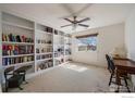 Bright office space with built-in bookshelves, perfect for working from home at 13874 Adams Cir, Thornton, CO 80602