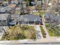 Aerial view of home showcasing landscaping, driveway, and roof in established neighborhood at 1529 Washington Ave, Louisville, CO 80027