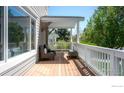 Relaxing covered porch with chairs, bench, and backyard views at 1835 Columbine Ave, Boulder, CO 80302