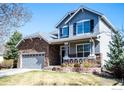 Attractive two-story home with a stone-accented garage and a covered front porch at 1867 W 131St Ln, Denver, CO 80234