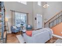 Bright living room with high ceilings, hardwood floors, and comfortable seating at 1867 W 131St Ln, Denver, CO 80234