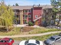 Aerial view of multi-Gathering home, featuring colorful exteriors, private balconies, and well-maintained landscaping at 2867 Sundown Ln # 106, Boulder, CO 80303