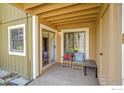 Cozy outdoor patio area with comfortable seating, sliding glass doors, and a tranquil view at 2867 Sundown Ln # 106, Boulder, CO 80303