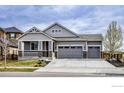 Attractive single-Gathering home boasts a well-manicured lawn and a convenient three-car garage at 441 Dusk Pl, Erie, CO 80516