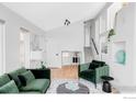 Bright living area with modern decor, hardwood floors, and comfortable green furniture at 590 Yuma Cir, Boulder, CO 80303