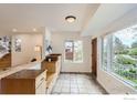 Bright entryway featuring tile floors, custom built-in shelving, and plenty of natural light at 775 Grape Ave, Boulder, CO 80304