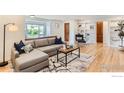Cozy living room features stylish sectional sofa, chic rug, and bright natural light at 775 Grape Ave, Boulder, CO 80304
