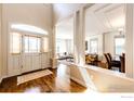 Elegant foyer featuring hardwood floors, high ceilings, and views into the living and dining areas at 789 Zamia Ave, Boulder, CO 80304