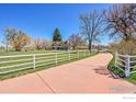Beautiful property featuring a long driveway leading to a home with mature trees at 2994 75Th St, Boulder, CO 80301