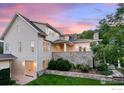 Spacious backyard featuring manicured lawn, stone wall and exterior access to basement at 3132 5Th St, Boulder, CO 80304