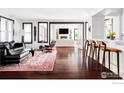 Bright and modern living room with dark wood floors, stylish furnishings, and an open layout at 3132 5Th St, Boulder, CO 80304