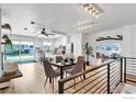 Open-concept dining area with stylish furniture and lighting, seamlessly connected to the living room at 3205 19Th St, Boulder, CO 80304