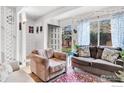 A comfortable living room with large windows and a doorway to the yard at 3582 Broadway St, Boulder, CO 80304