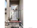 Inviting front entrance with a decorative door, large window above, and classic architectural details at 4156 15Th St, Boulder, CO 80304
