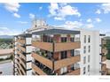 Balcony view features seating and decor with views from multiple levels, showcasing an inviting outdoor living space at 4570 E Yale Ave # 1104, Denver, CO 80222