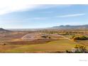 Aerial view outlining the property lines of a large parcel of land with trees and mountain views at 5196 Oxford Rd, Longmont, CO 80503