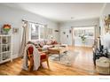 Cozy living room with hardwood floors, neutral walls, comfortable seating, and great natural light at 2121 Grove Cir, Boulder, CO 80302