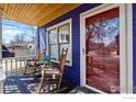 Charming front porch featuring rocking chairs and a view of the neighborhood at 2276 Goss Cir, Boulder, CO 80302