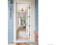 Inviting entryway showcasing an open floor plan leading to a dining area with modern furnishings at 2341 Feathergrass Ln, Superior, CO 80027