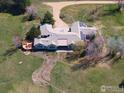 Aerial view featuring a beautiful backyard, exterior deck and solar panels at 7940 Valmont Rd, Boulder, CO 80301
