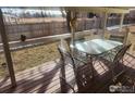 Inviting wooden deck with seating, perfect for enjoying the outdoors at 809 Flamingo Cv, Lafayette, CO 80026