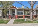 Attractive single-story home with inviting front porch, featuring red and white trim at 932 Welch Ave, Berthoud, CO 80513