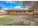 Charming single-story brick home with manicured front lawn at 9840 W 41St Ave, Wheat Ridge, CO 80033