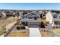A high-angle view of the two-story home, highlighting its location in a residential area at 13485 Niagara St, Thornton, CO 80602