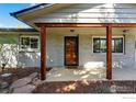 Inviting covered front porch with wood columns, brick facade, and a warm, welcoming entrance at 175 S 32Nd St, Boulder, CO 80305