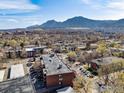 Aerial view showcasing the building's location with mountain views in the background at 2227 Canyon Blvd # 306A, Boulder, CO 80302