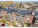 Exterior shot of building at 2227 Canyon Blvd 306 with balconies and mature trees at 2227 Canyon Blvd # 306A, Boulder, CO 80302