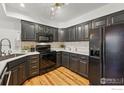 Modern kitchen with black cabinets, white countertops, and stainless steel appliances at 2700 Valmont Rd # 5, Boulder, CO 80304