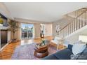 Bright living room with hardwood floors, large windows, and access to a private balcony at 2700 Valmont Rd # 5, Boulder, CO 80304