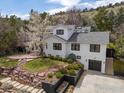 Stunning two-story home with a manicured lawn, a retaining wall, and a two-car garage at 2847 4Th St, Boulder, CO 80304