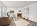 Bright living room with fireplace, plush seating, and neutral decor for a cozy and inviting atmosphere at 406 N Parkside Dr # C, Longmont, CO 80501