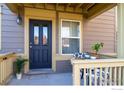 Relaxing front porch with comfortable seating, offering a welcoming outdoor space at 658 Casper Dr, Lafayette, CO 80026