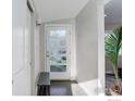 Bright entryway with hardwood floors, white door with glass panes, and bench at 740 32Nd St, Boulder, CO 80303