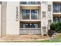 View of condo balcony area with neutral color palette and visible unit numbers at 9680 Brentwood Way # 203, Broomfield, CO 80021