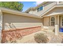 Charming entryway with brick accents and a welcoming front door at 1202 Warrior Way, Lafayette, CO 80026