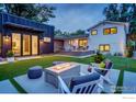 Inviting backyard featuring a modern patio, cozy fire pit, and stylish outdoor seating, perfect for evening gatherings at 1670 Linden Ave, Boulder, CO 80304