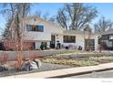 Charming updated home boasts a well-manicured front yard and modern curb appeal at 1670 Linden Ave, Boulder, CO 80304
