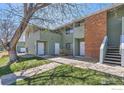 Exterior view of multi-Gathering unit with lawns and walkway at 1805 Chalcis Dr # E, Lafayette, CO 80026