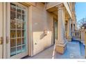 Exterior view of front entryway featuring stone facade, columns and sidelight windows at 1950 N Logan St # 102, Denver, CO 80203