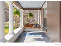 Relaxing front porch with a comfortable swing and decorative rug for a cozy outdoor space at 329 Bross St, Longmont, CO 80501