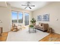 Bright living room with hardwood floors, neutral walls, modern furniture, and a lovely view at 3601 Arapahoe Ave # 422, Boulder, CO 80303